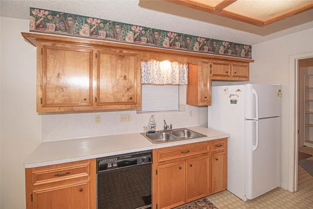a kitchen with stainless steel appliances a stove and a refrigerator