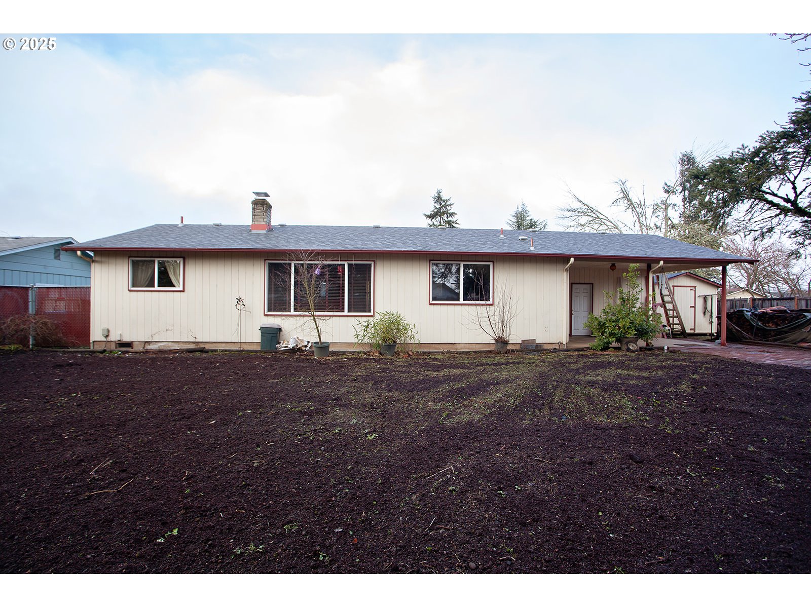677 Laksonen Loop Springfield, OR 97478 - Photo 20 of 22 a view of house with outdoor space and garden