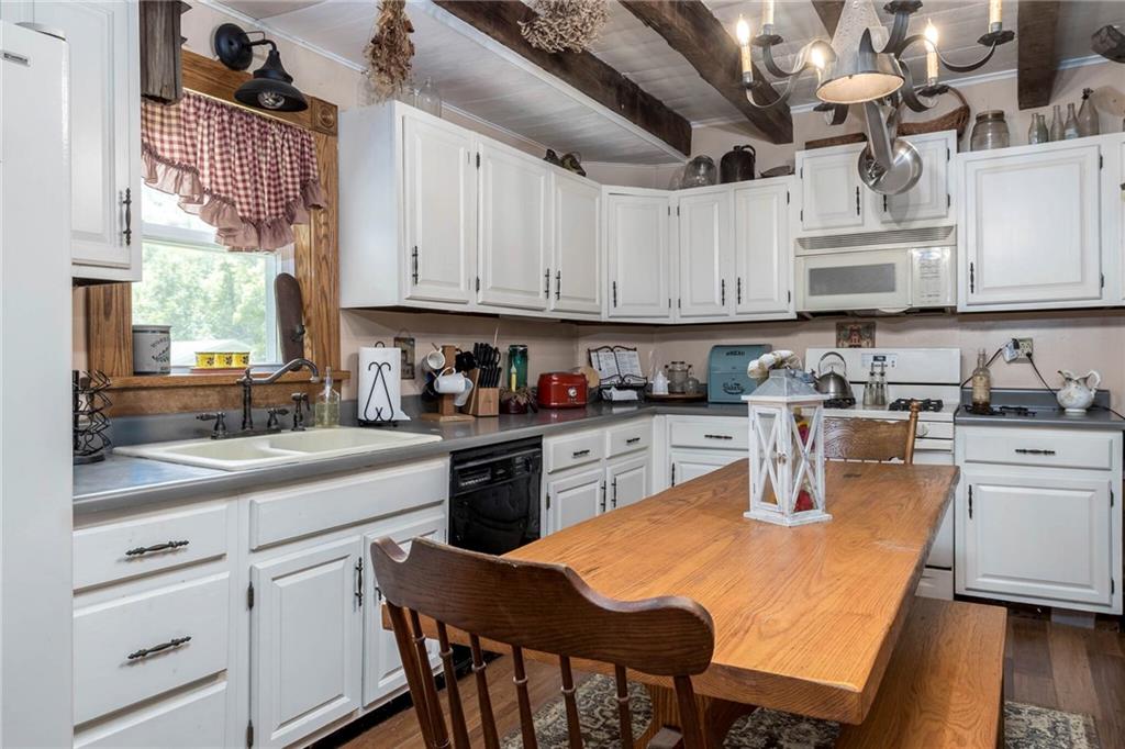 13 Penn Hill Road Prosperity, PA 15329 - Photo 20 of 30 a kitchen with stainless steel appliances granite countertop a sink a stove a refrigerator and cabinets
