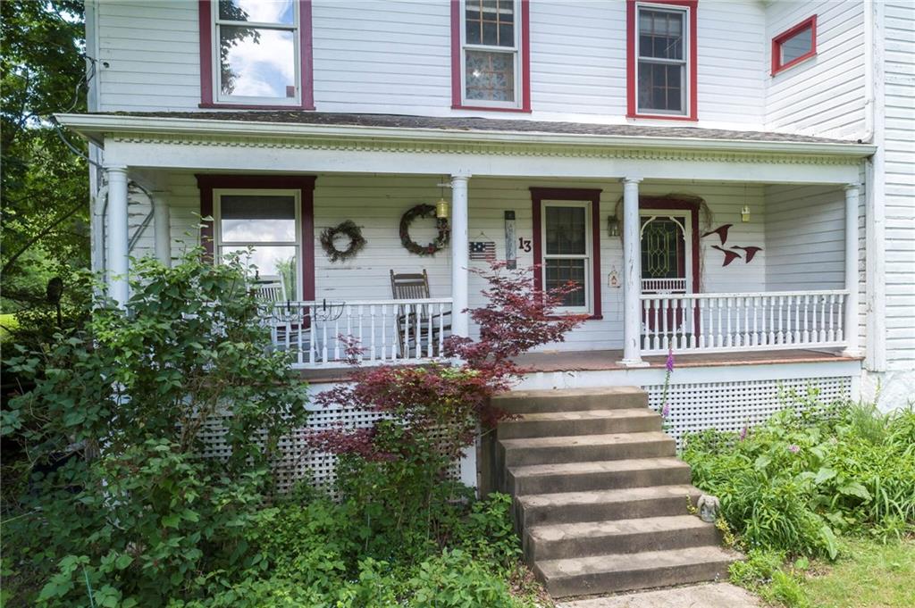 13 Penn Hill Road Prosperity, PA 15329 - Photo 2 of 30 a front view of a house with plants and garden