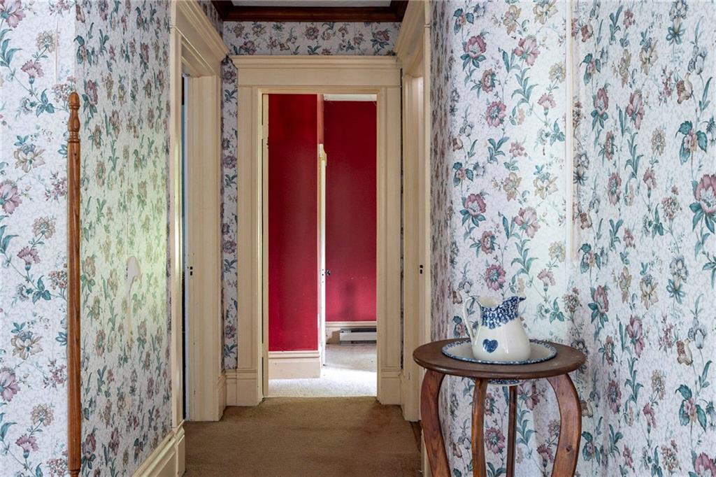 13 Penn Hill Road Prosperity, PA 15329 - Photo 24 of 30 a view of a hallway with chairs and a fireplace