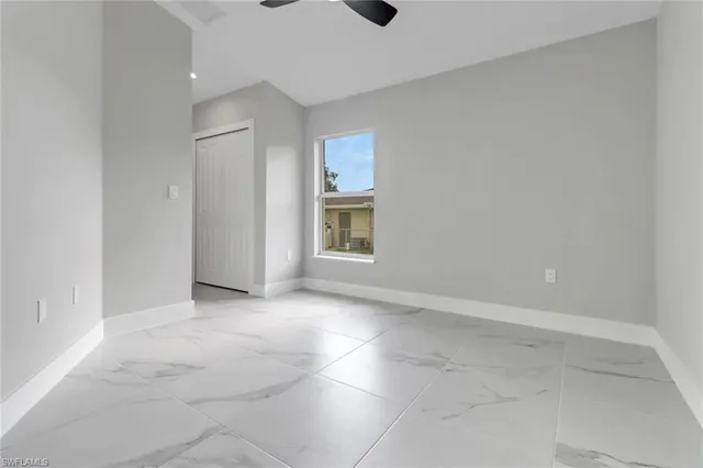 a view of an empty room with a bathroom