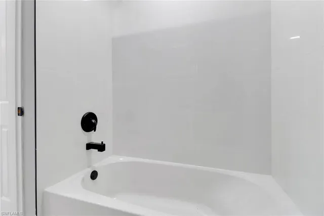 a kitchen with stainless steel appliances a refrigerator sink and stove