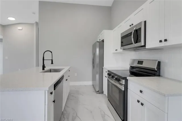 a bathroom with a sink a toilet and a bathtub