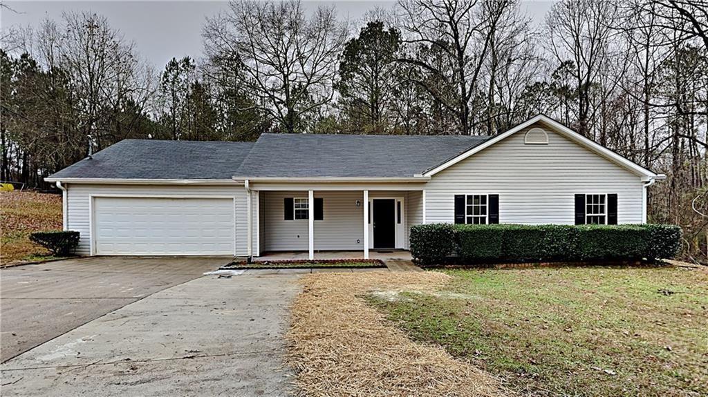 310 Sable Circle Covington, GA 30016 - Photo 1 of 1 a front view of a house with a yard