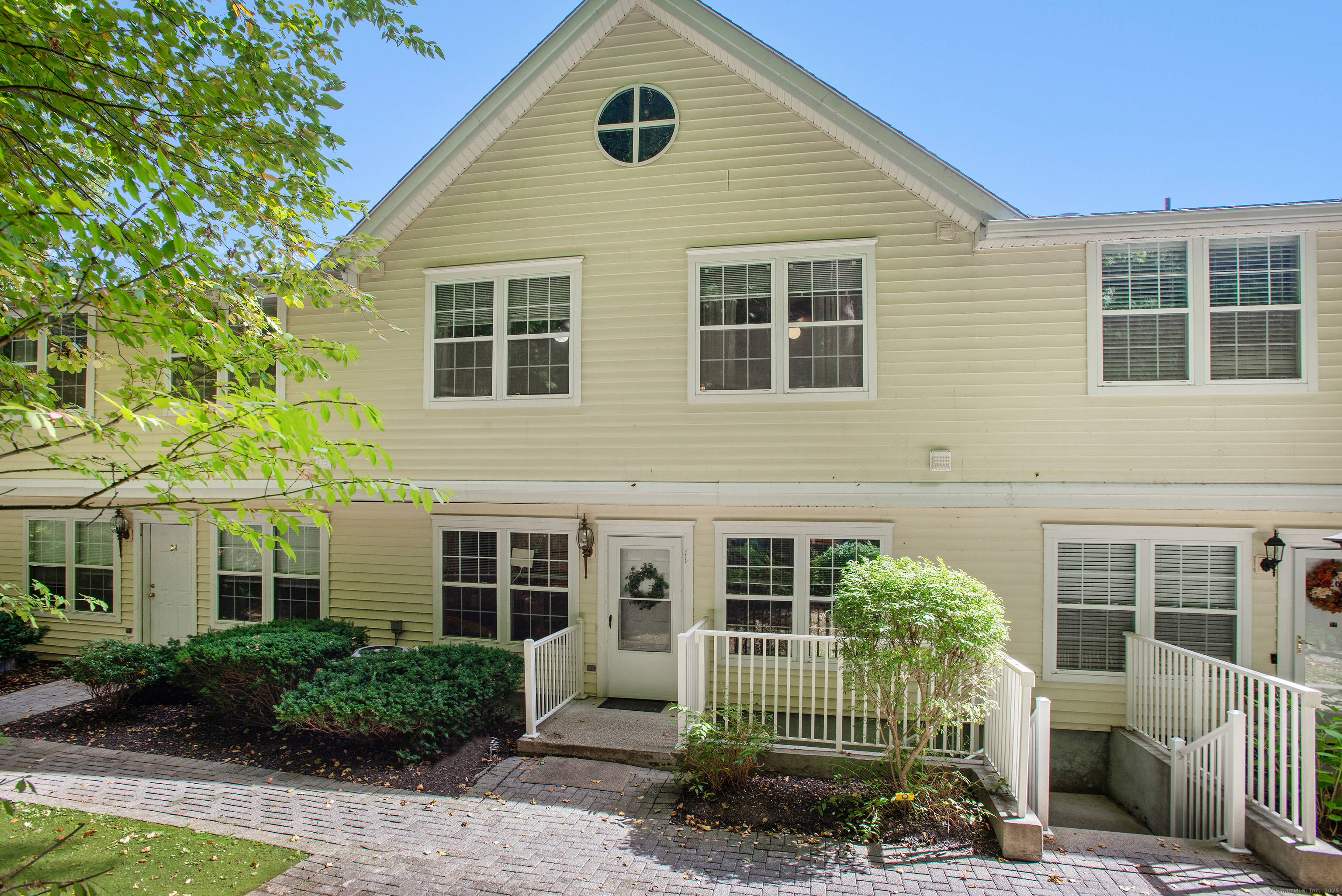 633 Danbury Road, Unit 25 Ridgefield, CT 06877 - Photo 1 of 1 a view of a house with a garden and plants