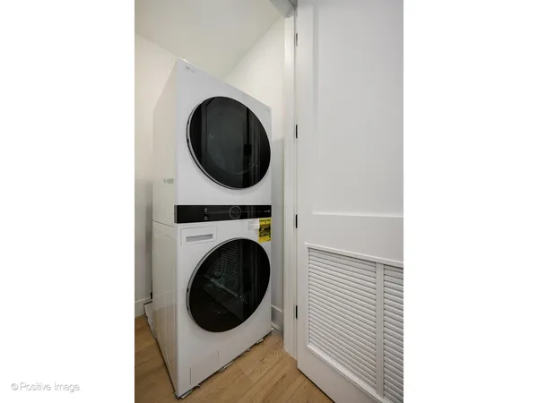 a view of a hallway with washer and dryer