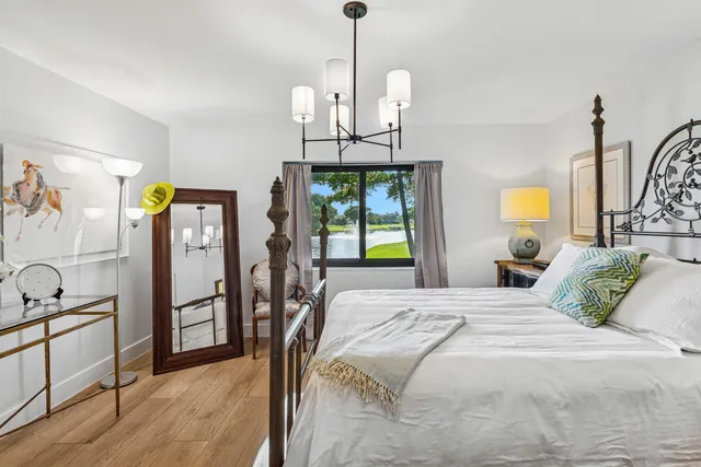 a bed room with a bed and a chair