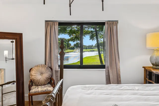 a bathroom with a granite countertop sink mirror and a shower