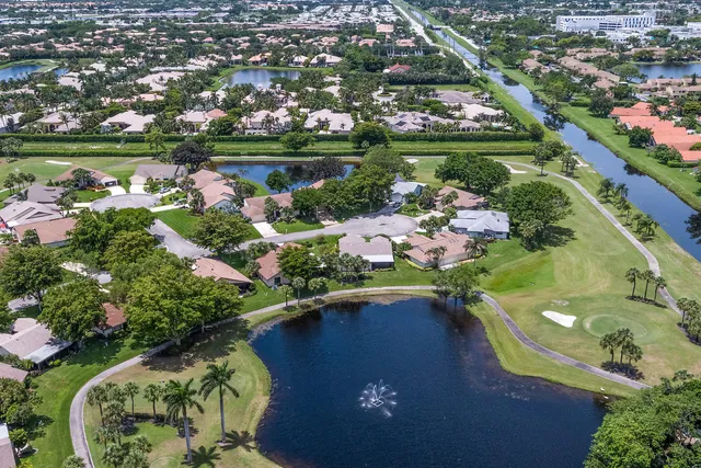 an aerial view of lake residential houses with outdoor space and seating