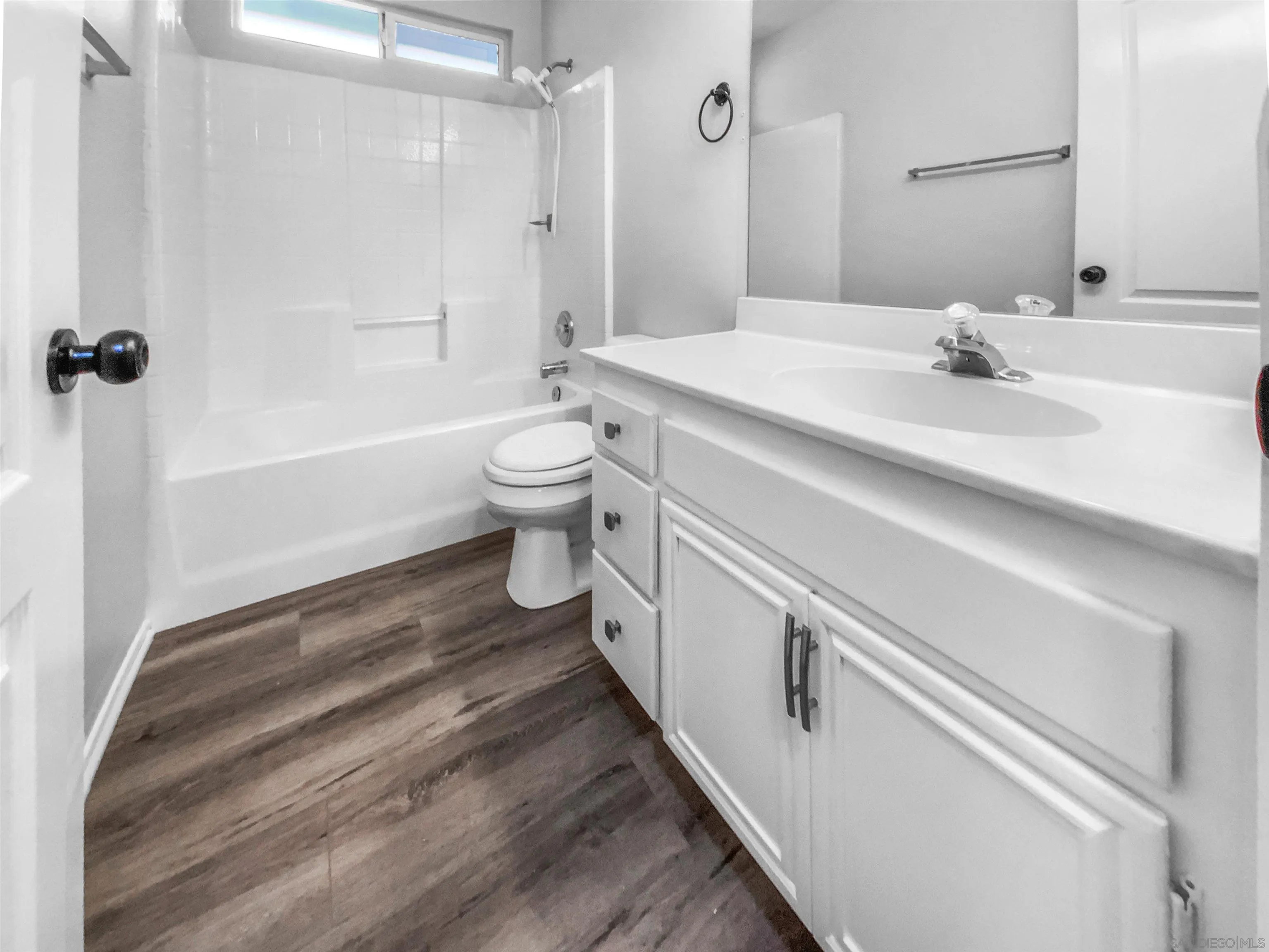 1822 McDougal Terrace El Cajon, CA 92021 - Photo 15 of 17 a bathroom with a sink a toilet and shower