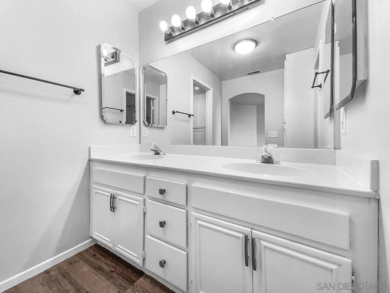1822 McDougal Terrace El Cajon, CA 92021 - Photo 7 of 17 a bathroom with a double vanity sink and mirror