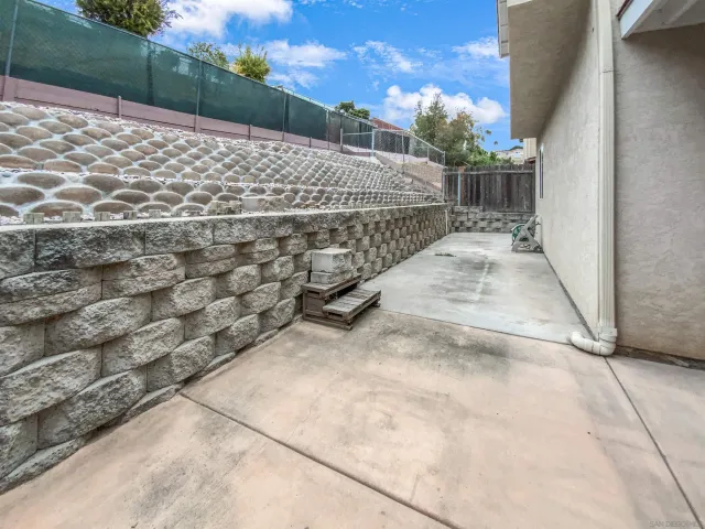 a view of a backyard with a street