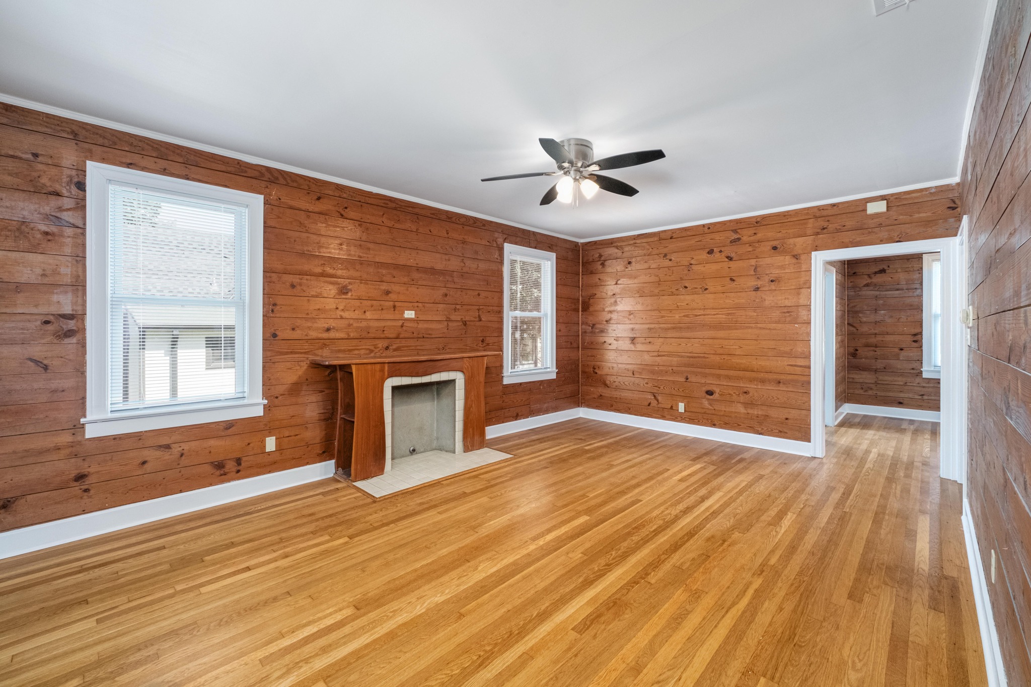 2012 Enfield Road, Unit B Austin, TX 78703 - Photo 4 of 20 Hardwood floors and a cozy decorative fireplace create a warm and inviting atmosphere.