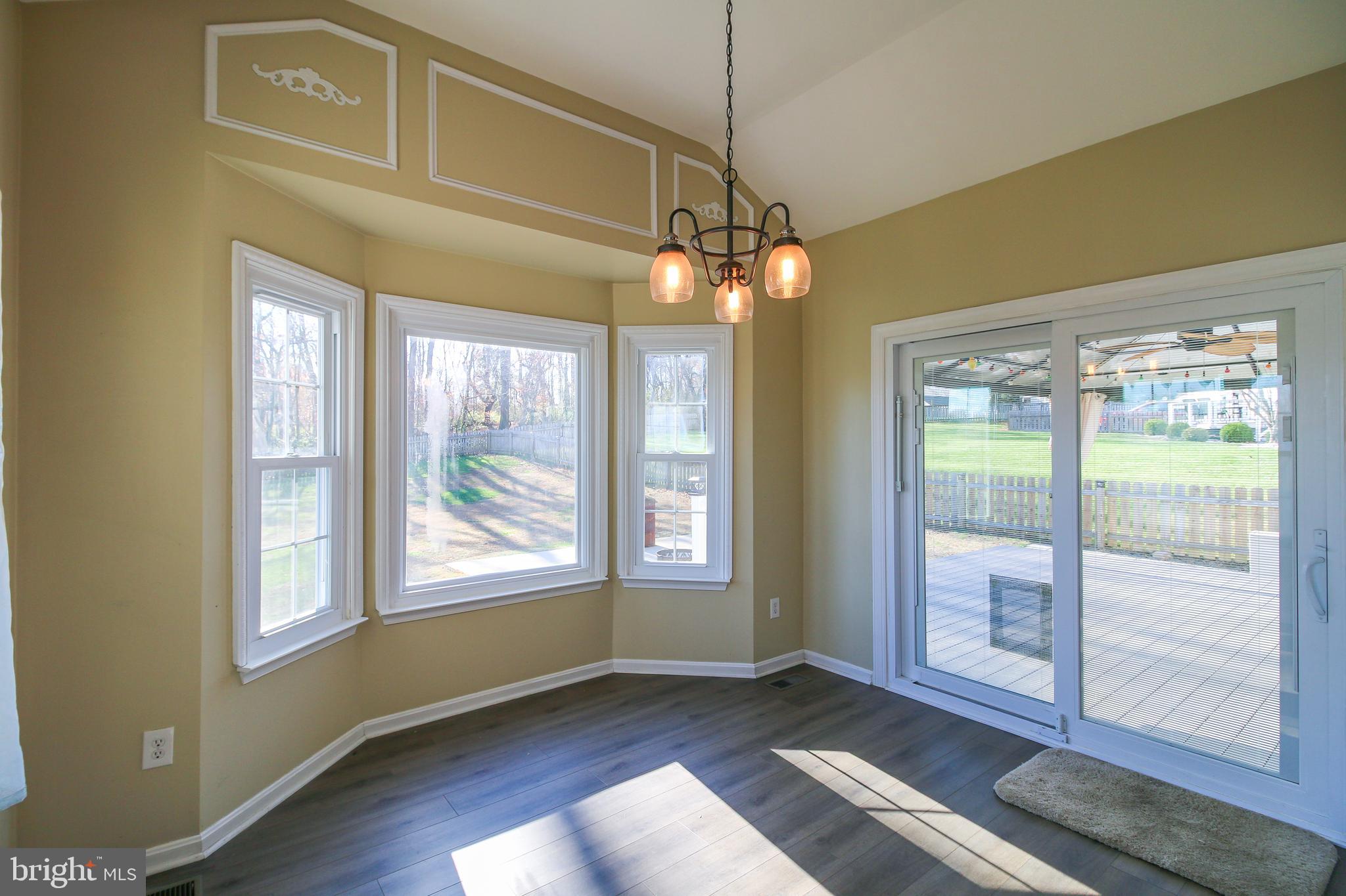 56 Cross Point Drive Owings, MD 20736 - Photo 12 of 54 a view of an empty room with wooden floor and a window