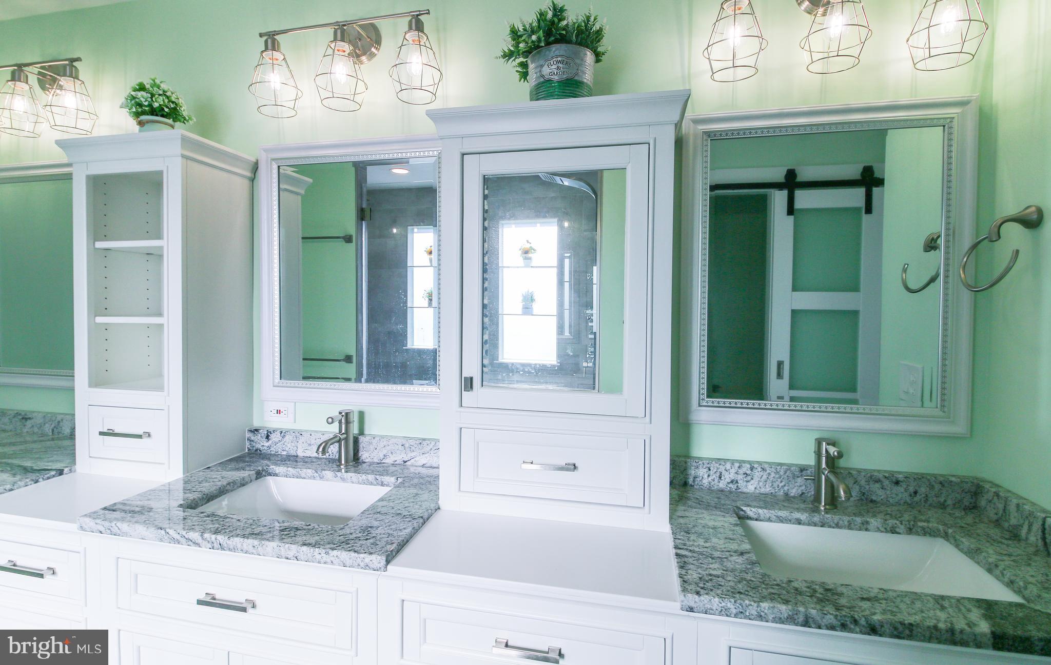 56 Cross Point Drive Owings, MD 20736 - Photo 18 of 54 a bathroom with a granite countertop sink and a mirror