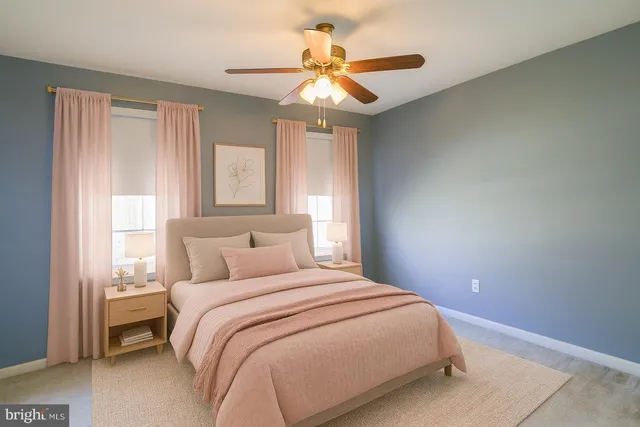 a bed room with a bed mirror and a window