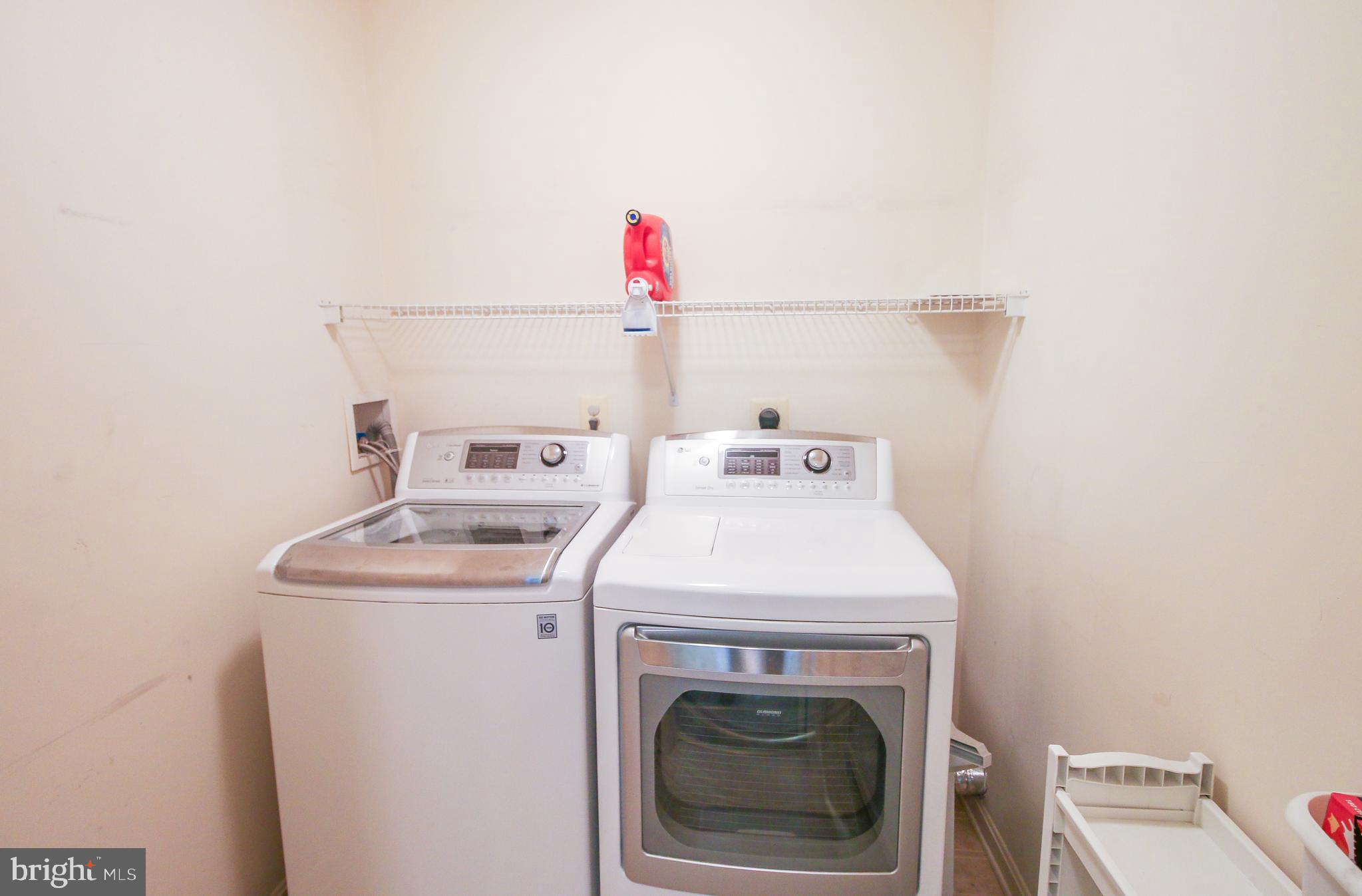 56 Cross Point Drive Owings, MD 20736 - Photo 33 of 54 a utility room with dryer and washer