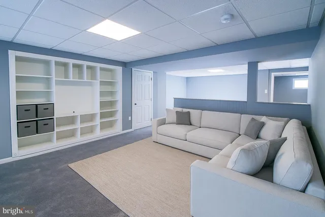 a kitchen with cabinets appliances a sink and a counter top space