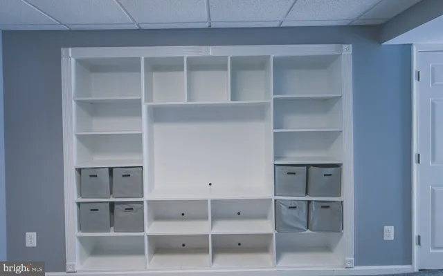 a bedroom with a bed and a lamp