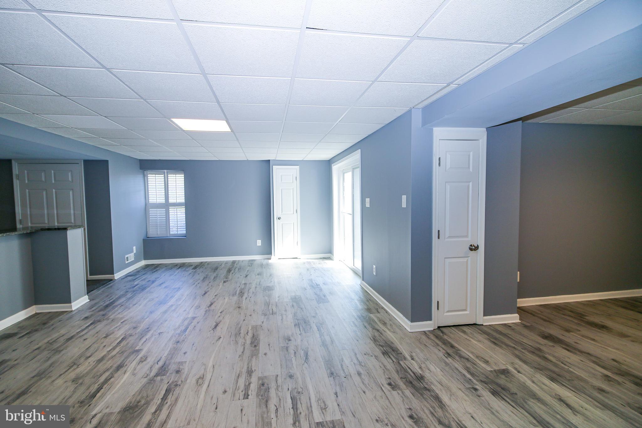 56 Cross Point Drive Owings, MD 20736 - Photo 39 of 54 a view of empty room with wooden floor and fan