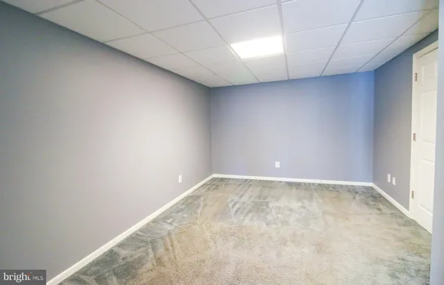 a view of a patio with table and chairs with wooden floor and fence