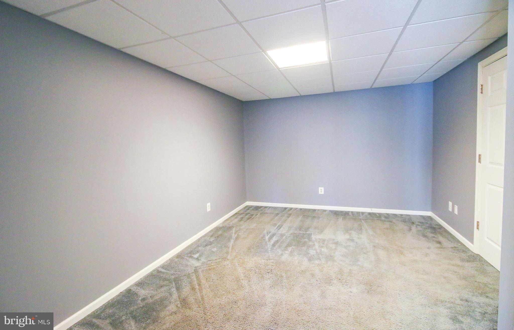 56 Cross Point Drive Owings, MD 20736 - Photo 41 of 54 an empty room with a empty space and windows