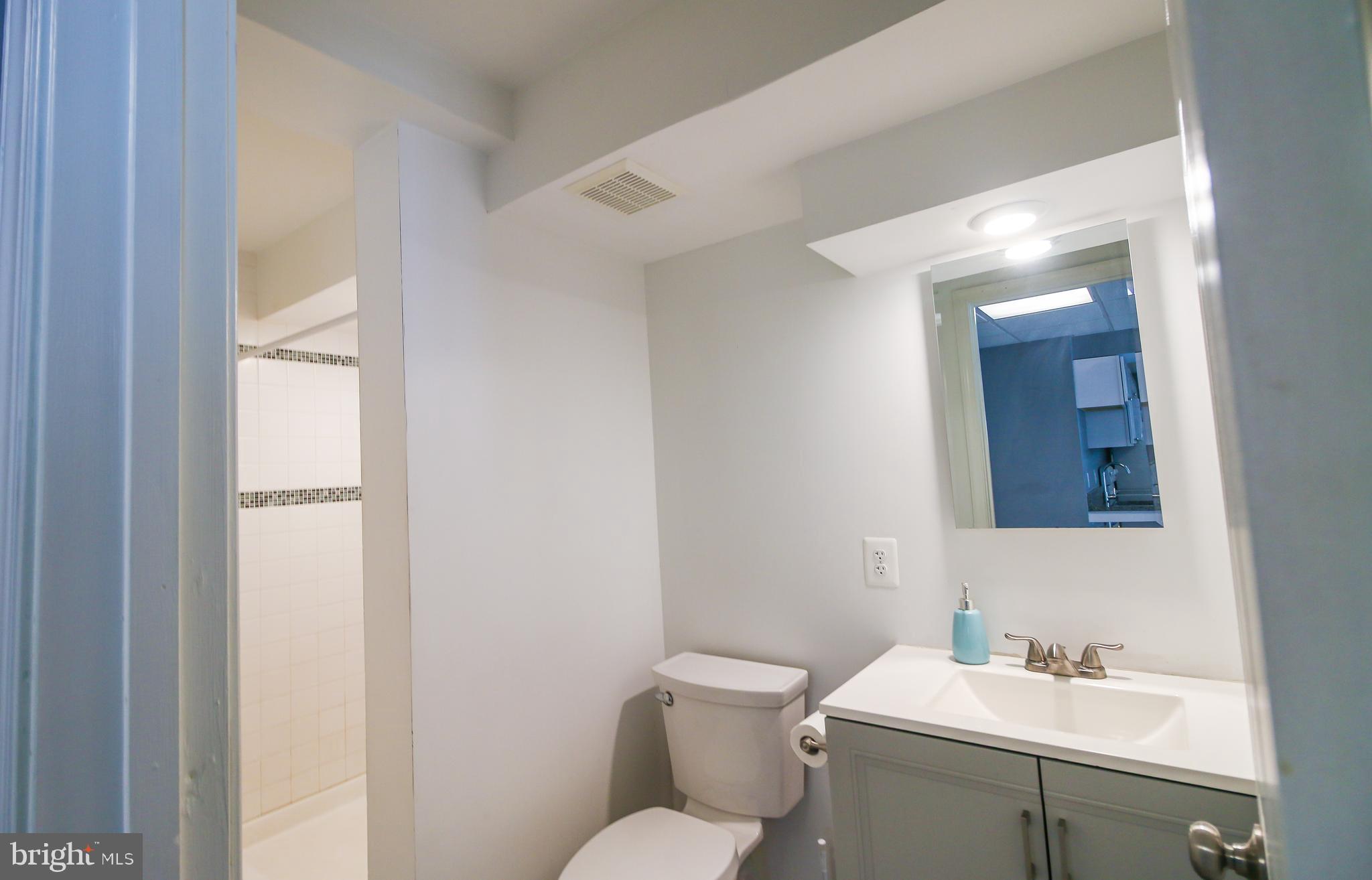 56 Cross Point Drive Owings, MD 20736 - Photo 42 of 54 a bathroom with a toilet sink and mirror