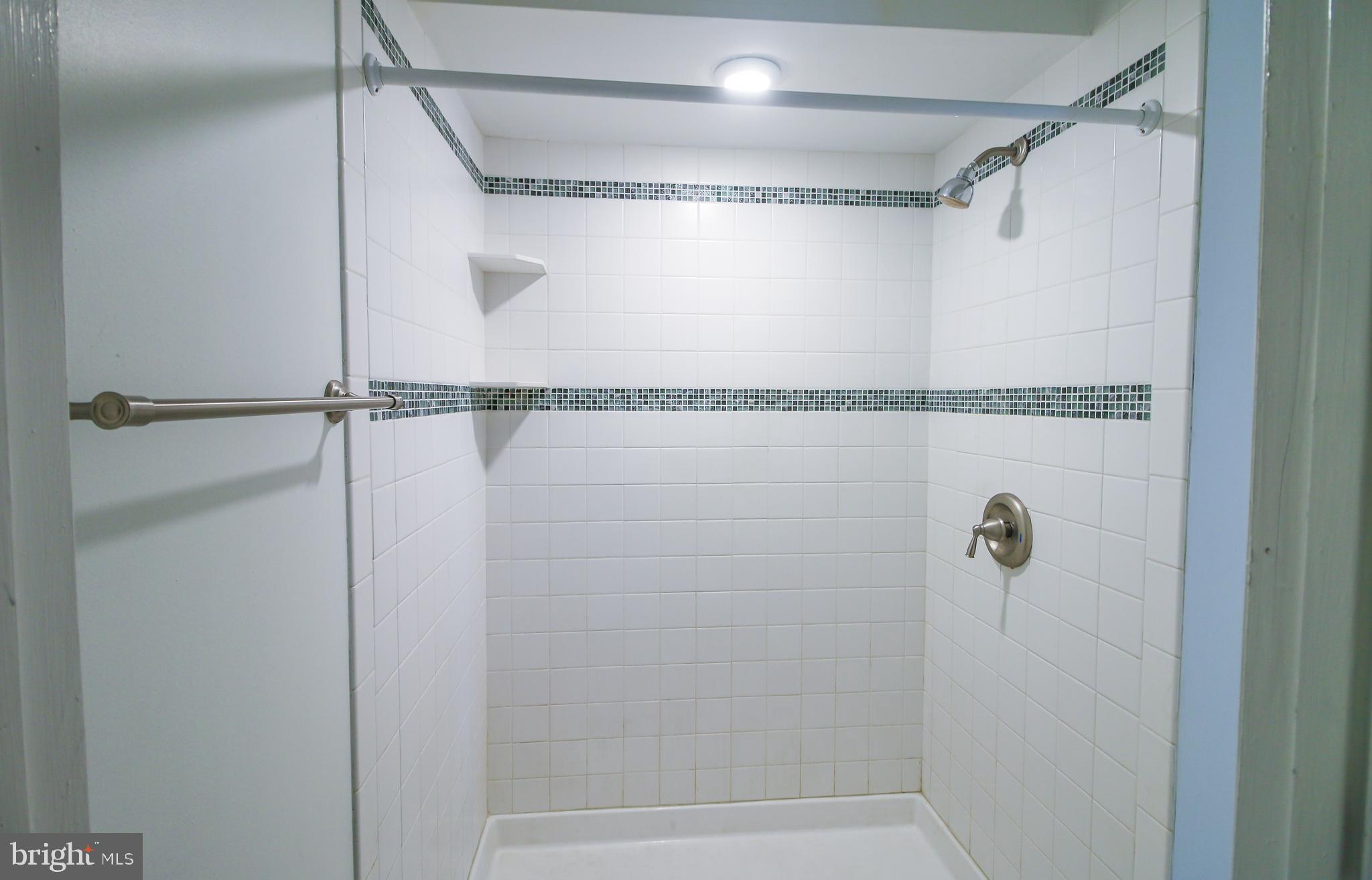 56 Cross Point Drive Owings, MD 20736 - Photo 43 of 54 a bathroom with a shower