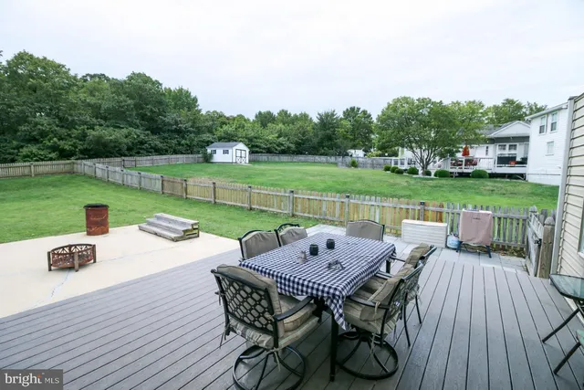 a view of a chairs and a table in the balcony