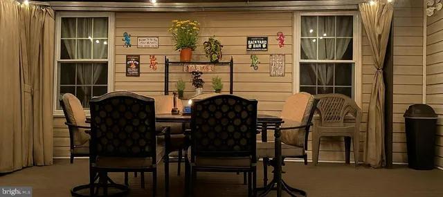 a view of a house with swimming pool and yard