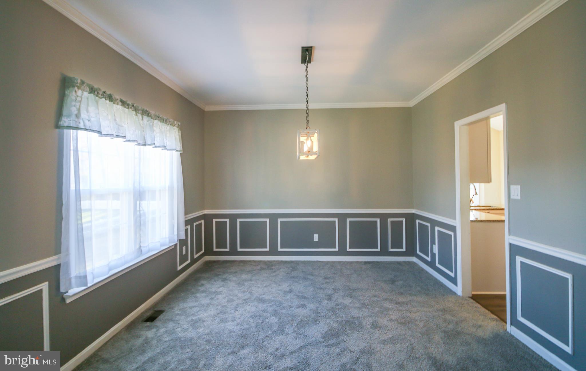 56 Cross Point Drive Owings, MD 20736 - Photo 5 of 54 a view of an empty room with chandelier fan and a window
