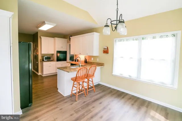 a large kitchen with cabinets