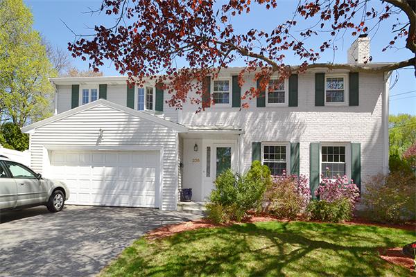 236 Parish Road Needham, MA 02494 - Photo 1 of 23 a view of a house with a cars park side of a road