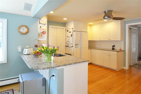 236 Parish Road Needham, MA 02494 - Photo 3 of 23 a kitchen with stainless steel appliances granite countertop a sink and a refrigerator