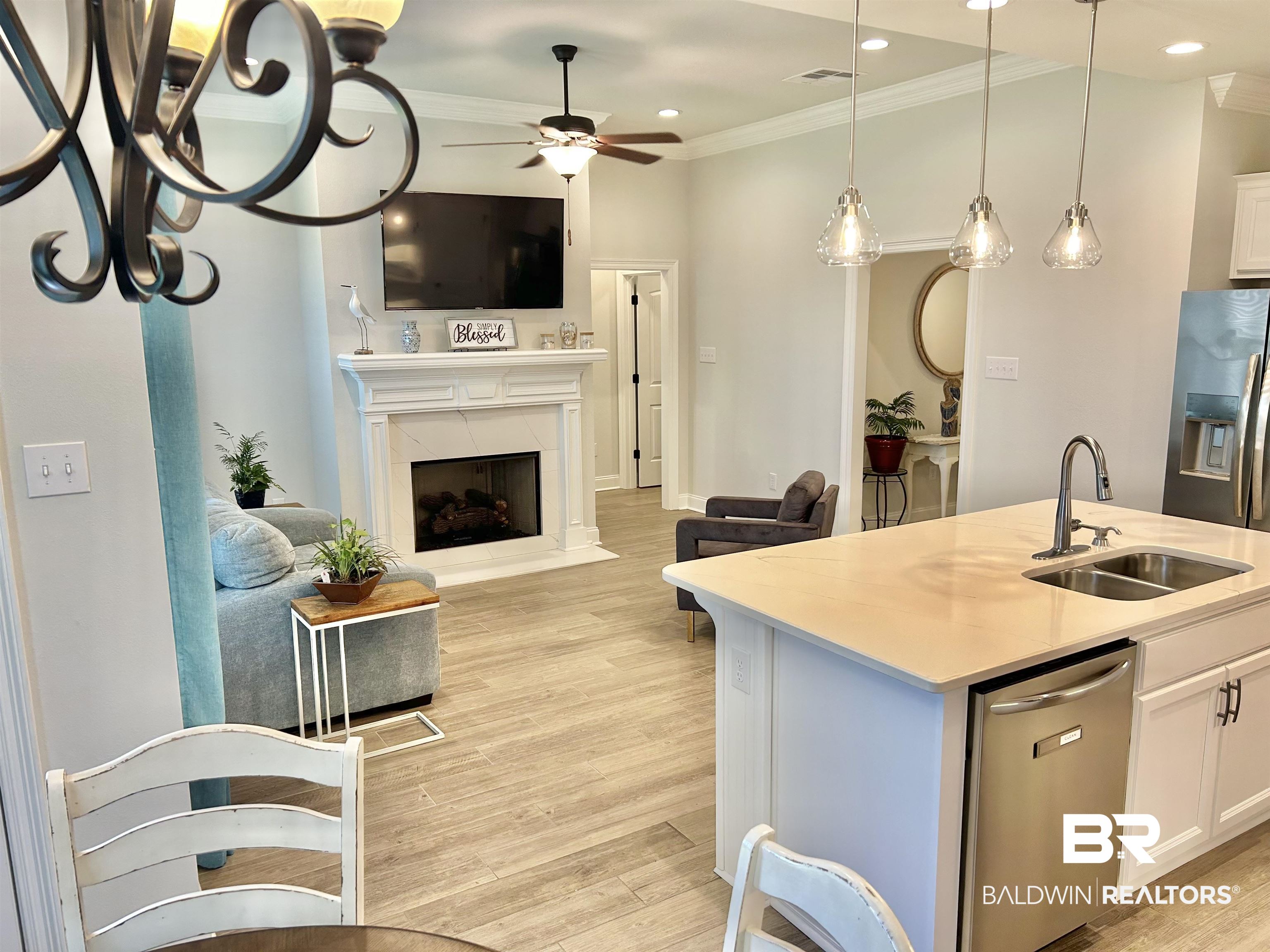 1398 Aldon Street Foley, AL 36535 - Photo 30 of 32 Kitchen featuring appliances with stainless steel finishes, white cabinets, light wood-look tile flooring, and ceiling fan