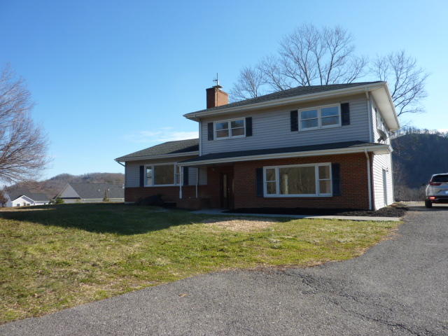 9700 Roanoke Road Elliston, VA 24087 - Photo 2 of 28 a front view of a house with a yard