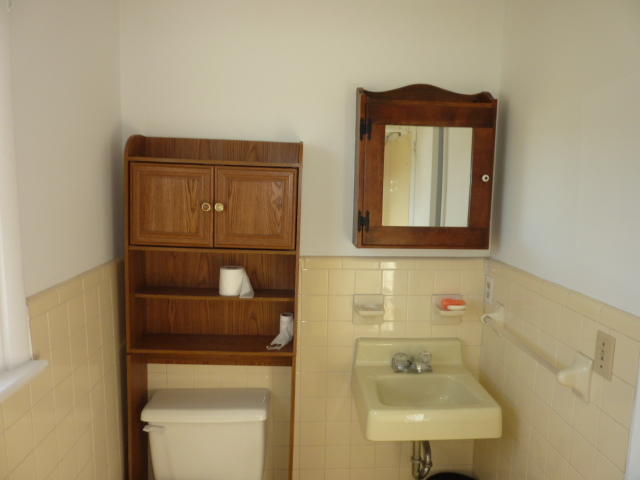 9700 Roanoke Road Elliston, VA 24087 - Photo 8 of 28 a bathroom with a toilet sink and mirror