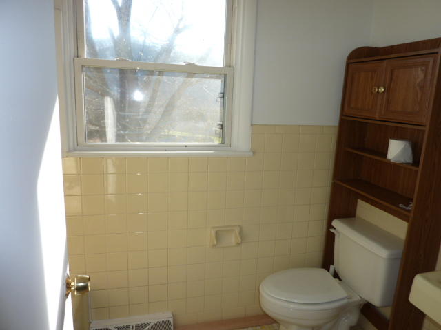 9700 Roanoke Road Elliston, VA 24087 - Photo 9 of 28 a white toilet sitting next to a window