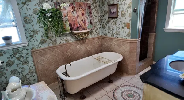 a bathroom with a toilet sink and tub