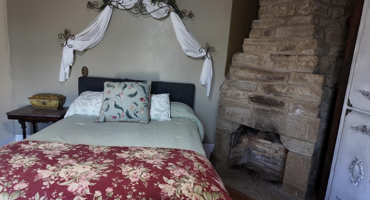 801 Mohawk Cherokee, TX 76832 - Photo 14 of 29 a bedroom with a bed and a chair in it