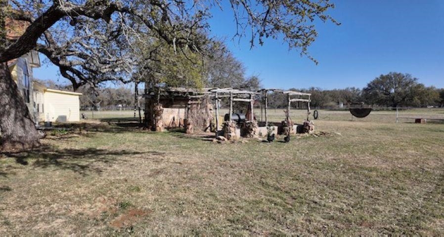 801 Mohawk Cherokee, TX 76832 - Photo 23 of 29 a view of a yard with wooden fence