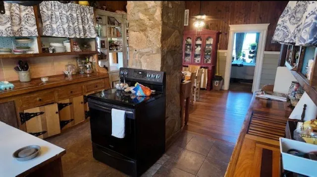 a kitchen with stainless steel appliances granite countertop a stove and a refrigerator