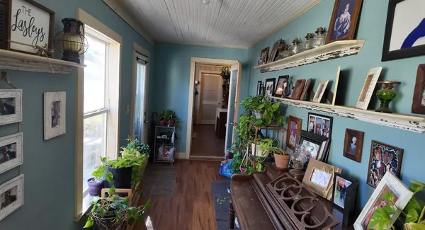a view of an entryway with wooden floor