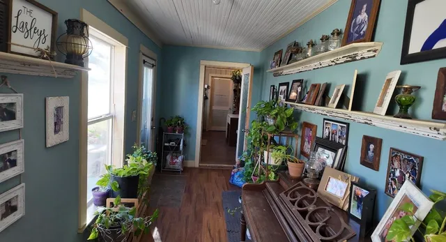 a view of an entryway with wooden floor