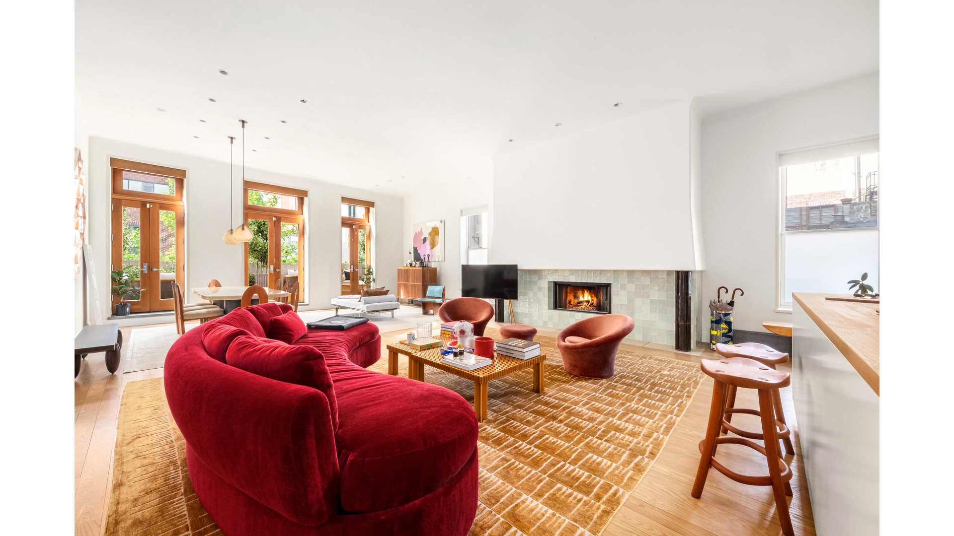 43 Wooster Street, Unit 2W Manhattan, NY 10013 - Photo 3 of 9 a living room with furniture fireplace and large windows