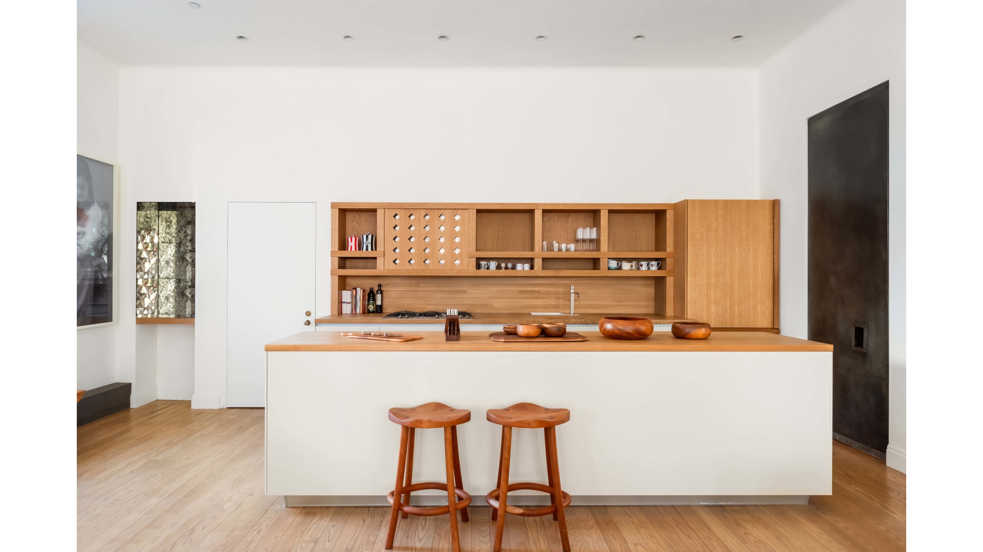 43 Wooster Street, Unit 2W Manhattan, NY 10013 - Photo 4 of 9 a dining table chairs and a refrigerator