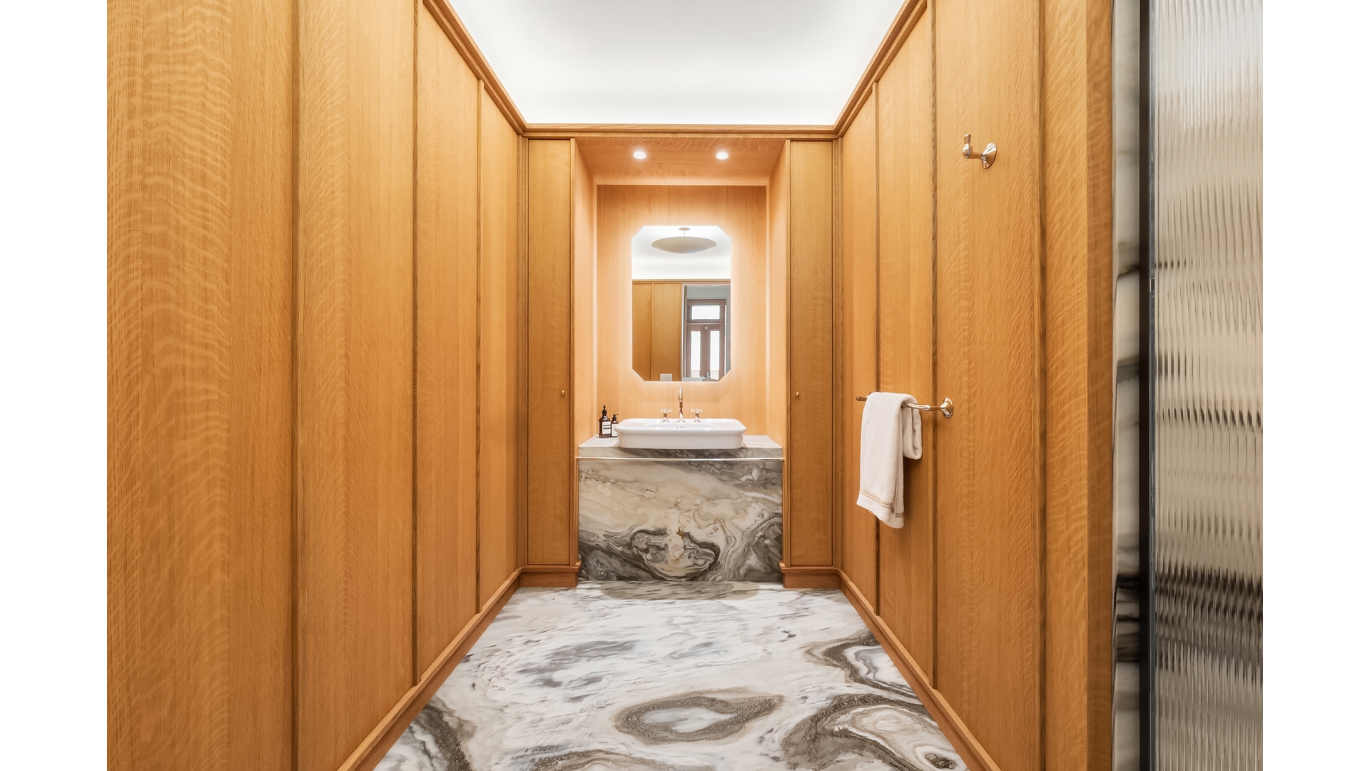 43 Wooster Street, Unit 2W Manhattan, NY 10013 - Photo 6 of 9 a view of a bathroom from a hallway