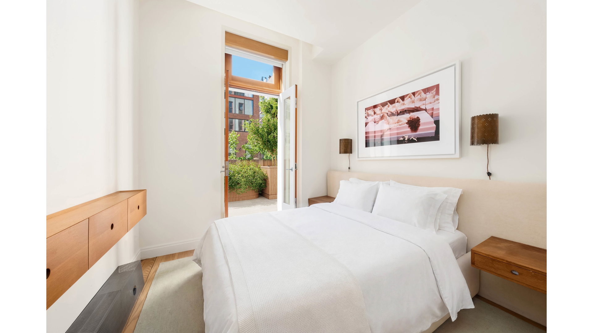 43 Wooster Street, Unit 2W Manhattan, NY 10013 - Photo 7 of 9 a bedroom with a bed and a window