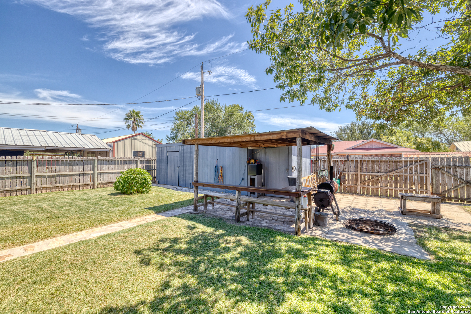 121 Rio Grande Street Uvalde, TX 78801 - Photo 15 of 29 a view of a house with backyard and sitting area